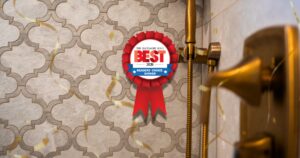 Red victory ribbon badge on a patterned tile wall announcing The Baltimore Sun's Best 2026 Readers' Choice Winner.